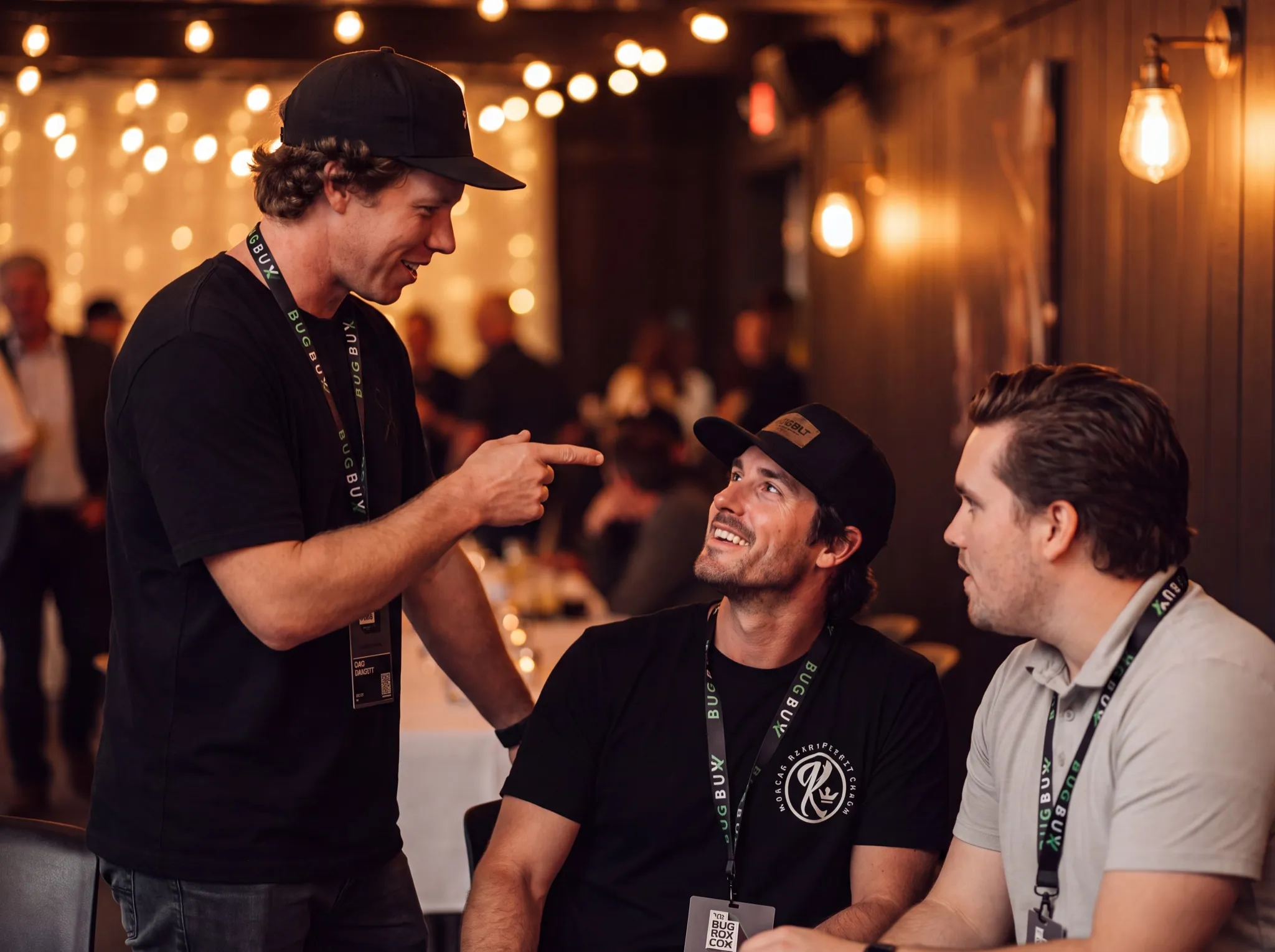 Bug Bux members talking and laughing together at an event