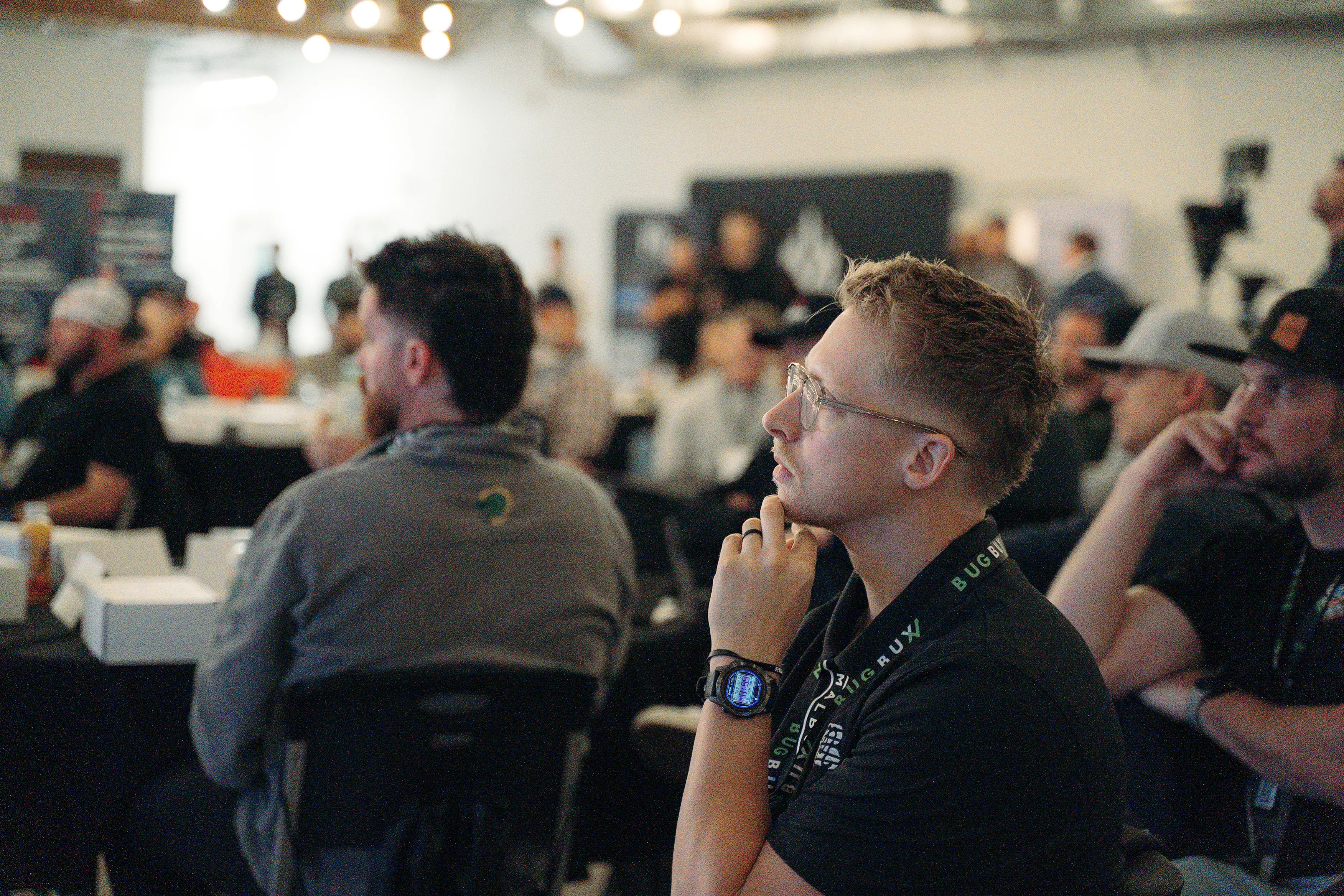 A speaker addressing the audience at a past Bug Bux Con