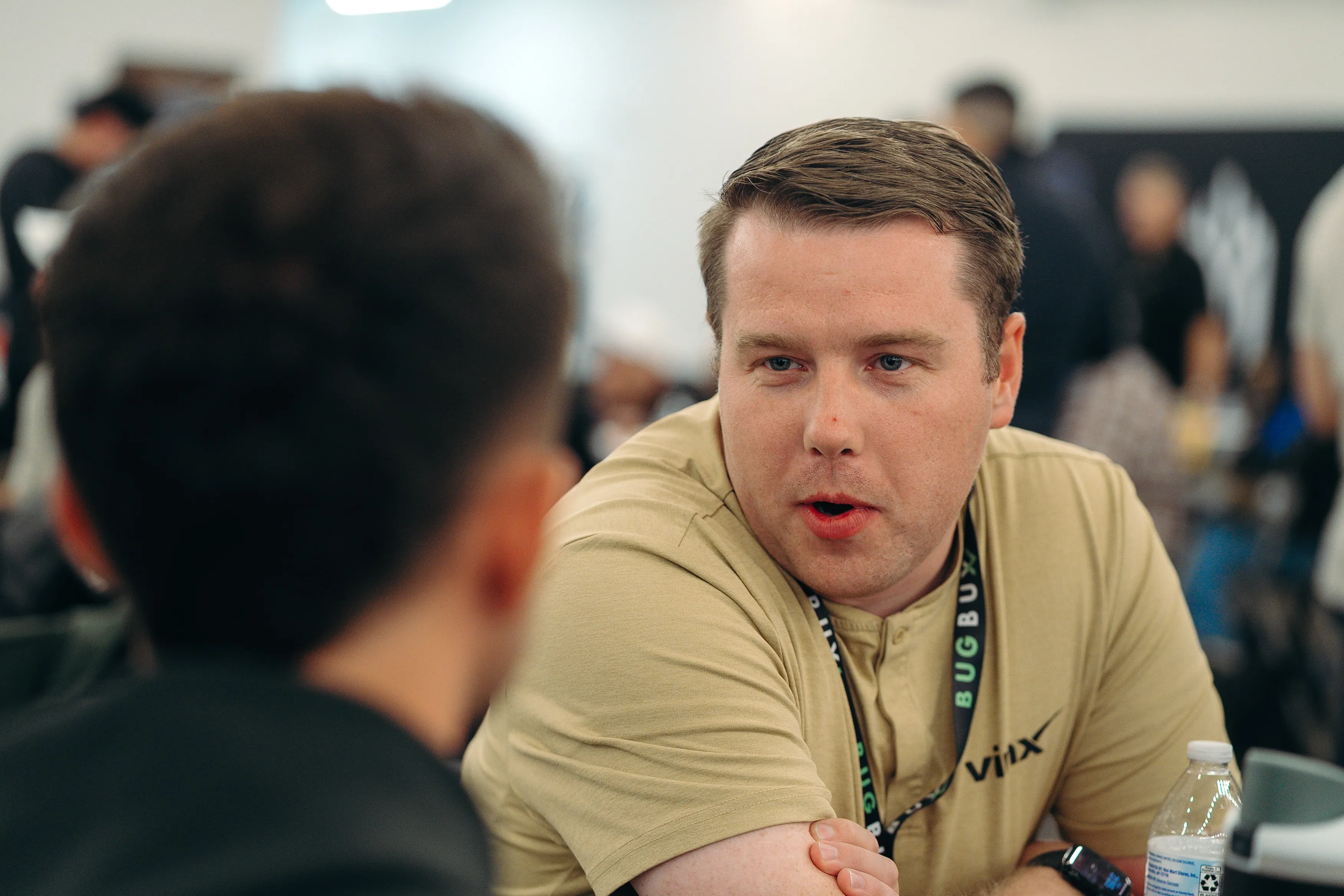 A pest control owner in conversation at Bug Bux Con